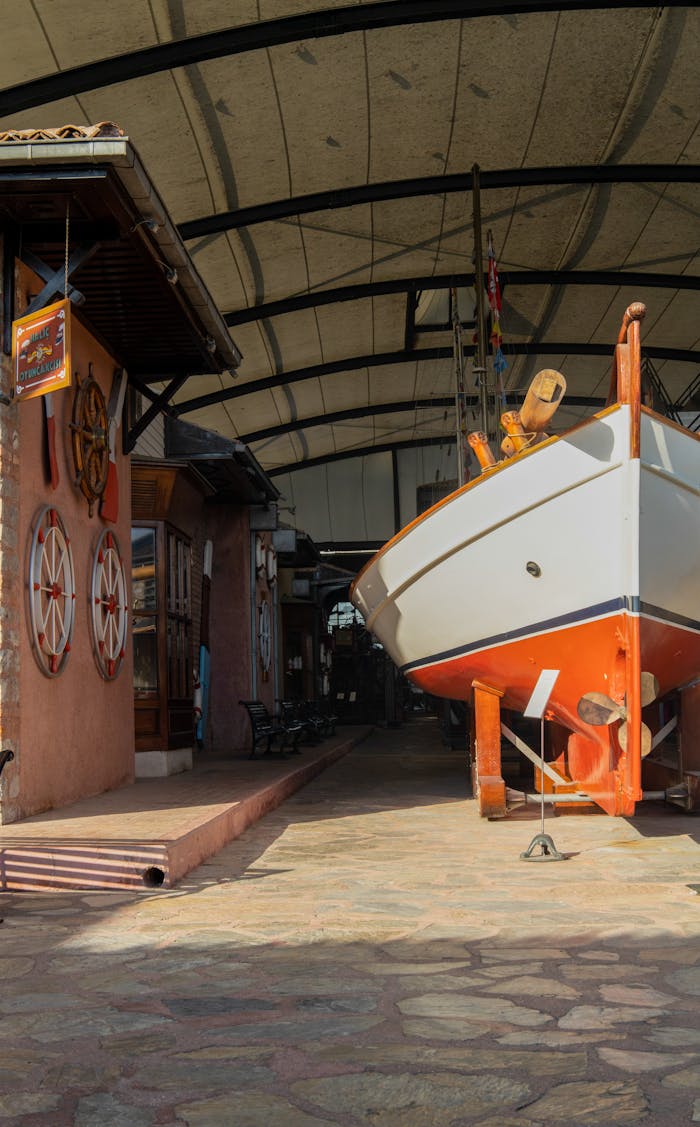 ship on pavement near decorated building wall 18330086.jpeg